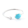 Xtinctio - Bangle Hand made in Italy by a 3rd generation Goldsmith. 925 sterling silver Triple dipped Palladium and turquoise enamel. Imbued with the spirit of the Ocean