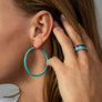 Xtinctio - Hand made in Italy by a 3rd generation Goldsmith. Eco conscious white Bronze and turquoise enamel. 50% of all profits go towards protecting the most endangered species on the planet earth. Ocean -