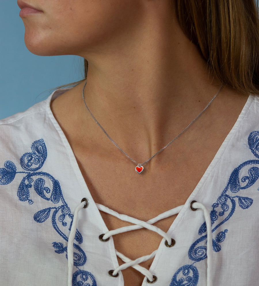 Xtinctio -  The S925 Heart Red Enameled pendant hangs on a 925 sterling silver necklace and represents your commitment to protecting wildlife.  Xtinctio donates 50% of our profits to organizations that protect the most endangered species on earth and their habitats.